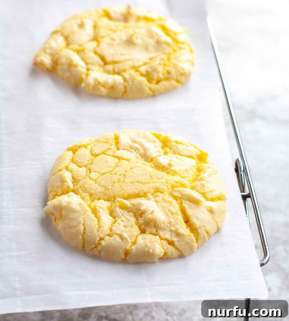 Cake Mix Lemon Cookies Cooling Freshly baked Lemon Cake Mix Cookies cooling on a wire rack, waiting for their glaze.