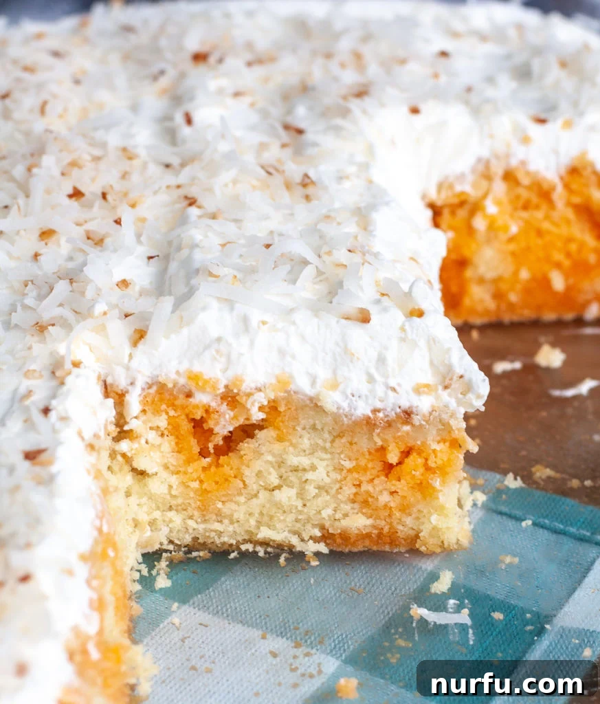 Orange Poke Cake in Baking Dish, cut