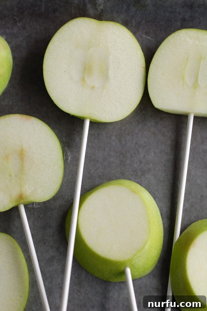 Chocolate Caramel Apple Delights 3 Apple slices being dipped in smooth caramel