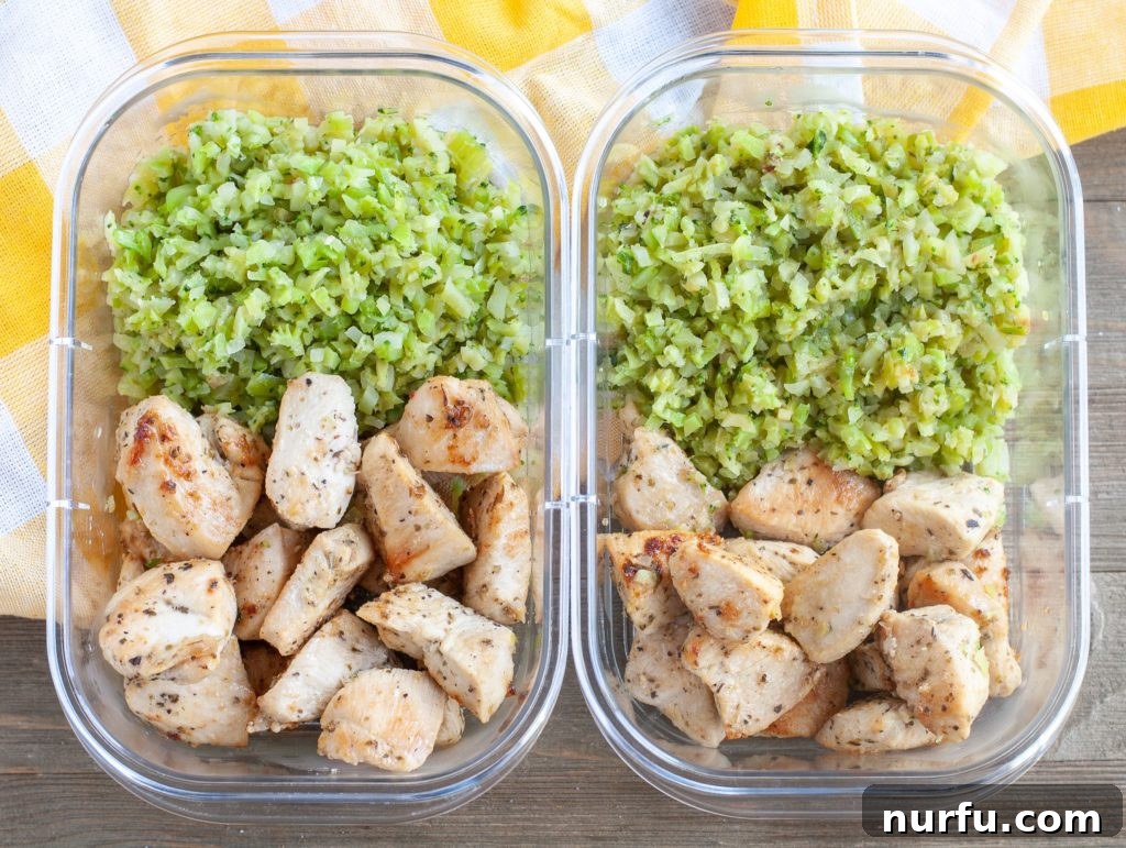 Meal Prep Containers Two meal prep containers, each filled with Garlic Butter Chicken and riced cauliflower and broccoli, ready for storage.