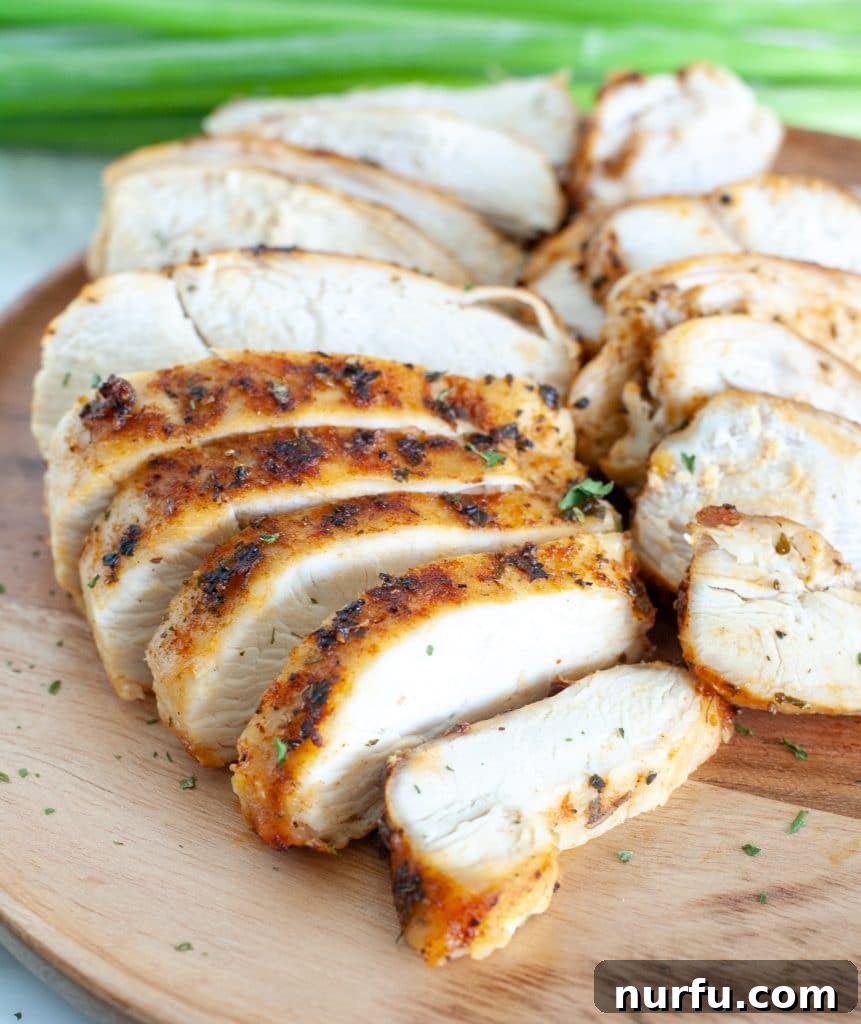 Perfect Air Fryer Chicken Breast 2 Perfectly Sliced Air Fryer Chicken Breast on a Plate Ready to Serve