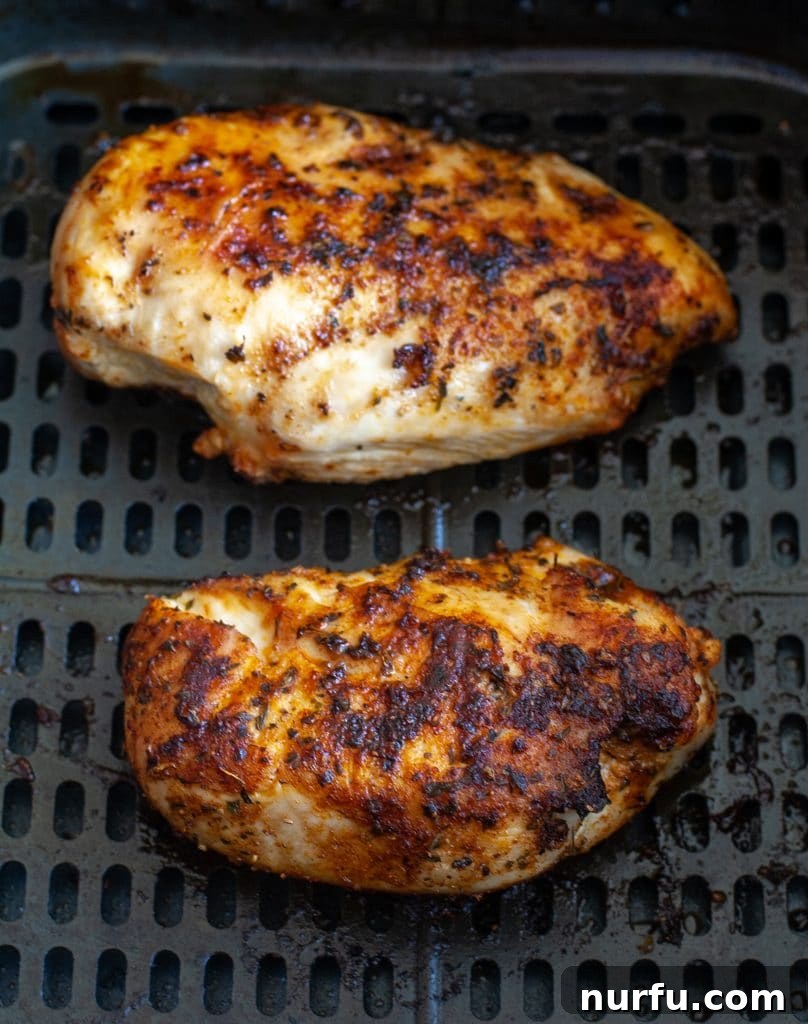 Perfect Air Fryer Chicken Breast 4 Cooked chicken in air fryer basket