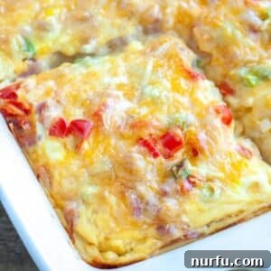 A beautifully baked Farmers Casserole in a baking dish, with golden-brown topping and rich filling.