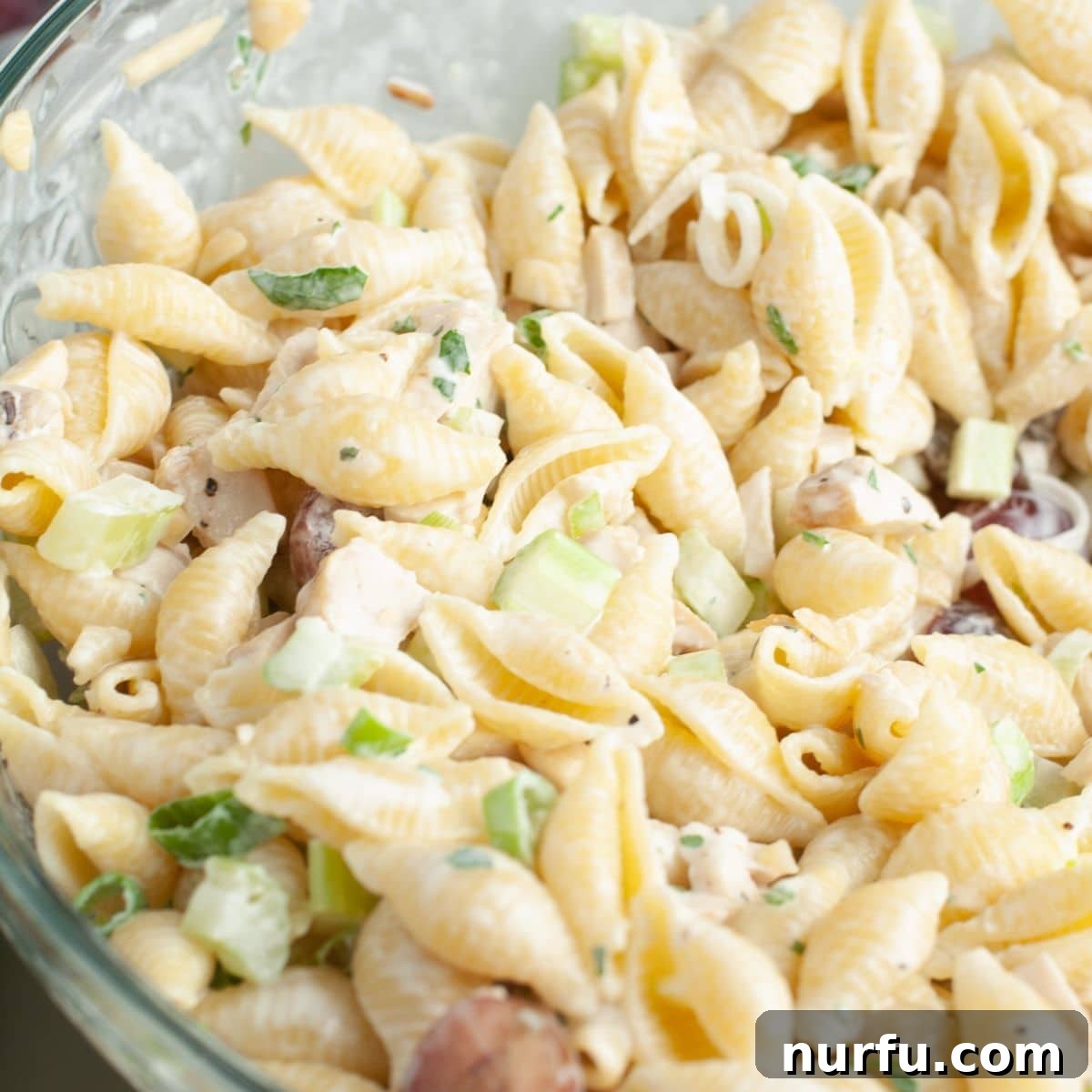 Vibrant Chicken Pasta Salad 4 Bowl full of pasta salad with chicken.