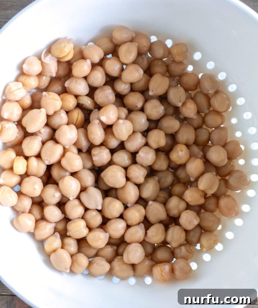 Air Fryer Roasted Chickpeas Drained chickpeas in a colander after rinsing.