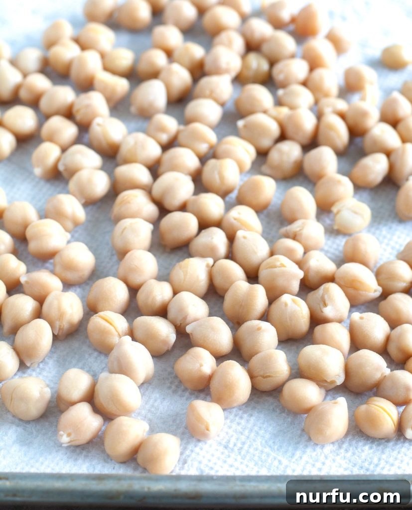 Air Fryer Roasted Chickpeas Chickpeas drying on a paper towel, prepared for seasoning.