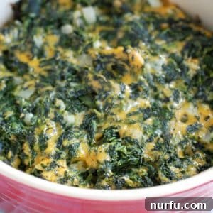 Spinach with cheese in casserole dish.