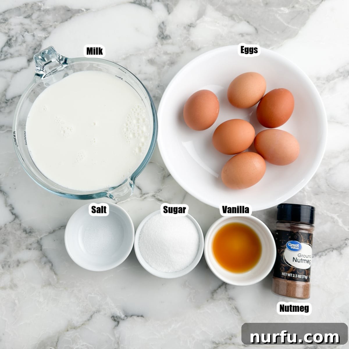 Effortless Velvety Egg Custard 3 A rustic arrangement of fresh eggs, a carton of milk, granulated sugar, vanilla extract, a pinch of salt, and a nutmeg grinder, showcasing the simple ingredients for egg custard.