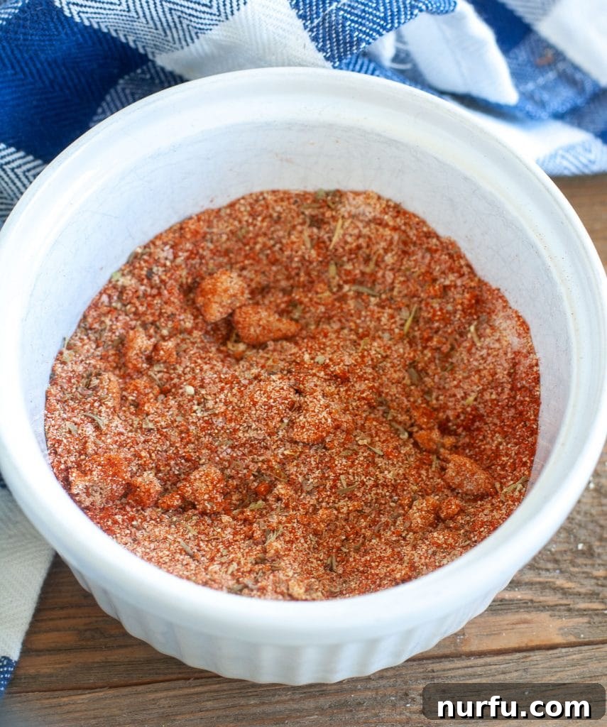 Air Fryer Rotisserie Chicken Chicken dry rub spices in a white bowl
