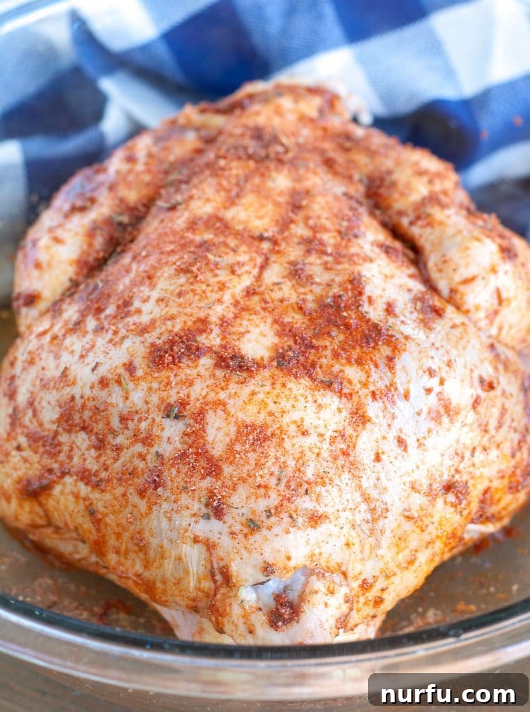 Air Fryer Rotisserie Chicken Whole Chicken with spice rub in a bowl