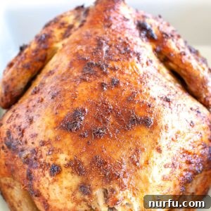 Perfect Air Fryer Rotisserie Chicken 2 Whole chicken in baking dish.