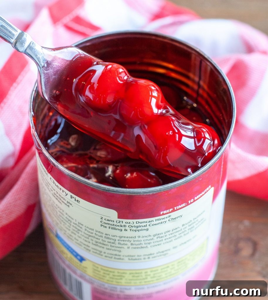 black forest chocolate chip brownies Can of cherry pie filling, showing the cherries to be used in the brownies.
