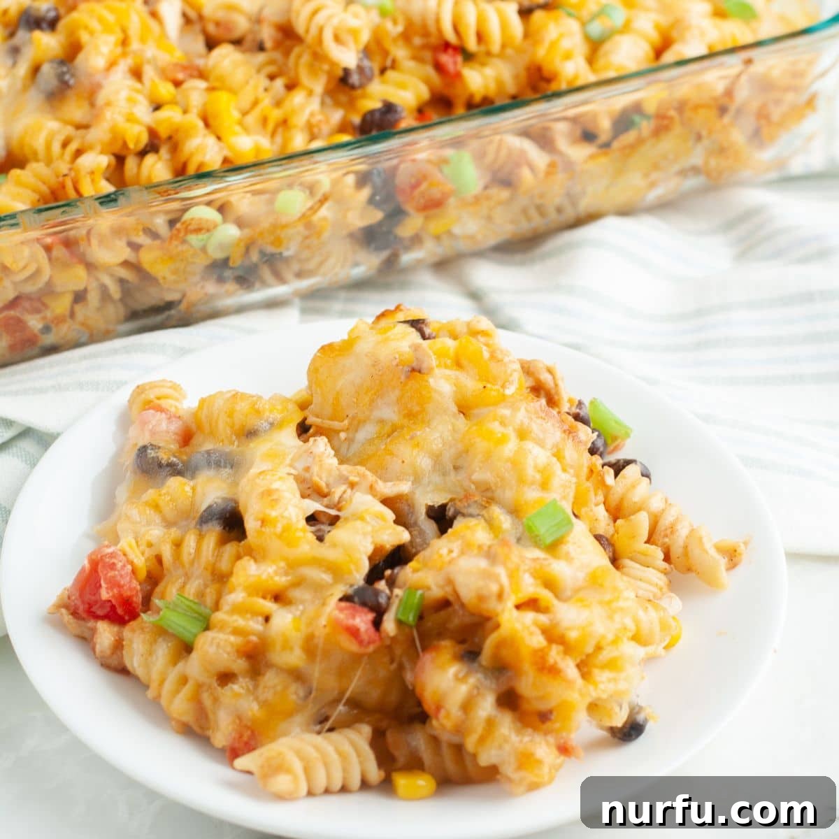 Celebration Chicken Bake 9 Plate of fiesta chicken casserole with a side of fresh cilantro.