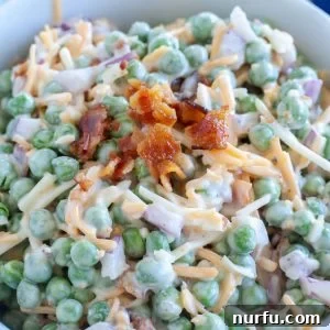Bowl with peas, cheese and bacon.