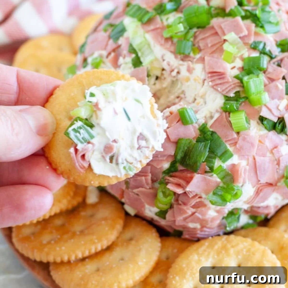 Signature Chipped Beef Cheese Ball 11 A perfectly prepared Chipped Beef Cheese Ball, ready to be served, resting on a serving plate.