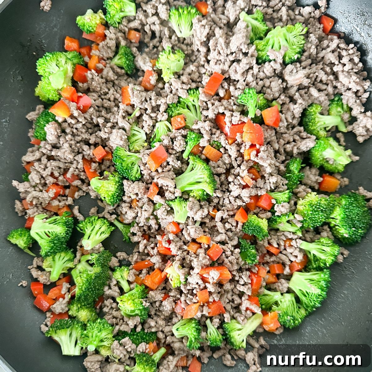 Savory Ground Beef Ramen 4 Skillet with ground beef, broccoli, and red peppers.