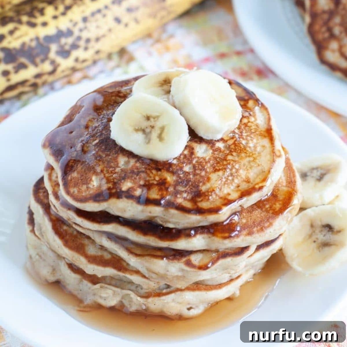 Wholesome Banana Oat Flapjacks 2 Stack of oatmeal banana pancakes, perfectly golden and ready to be enjoyed.