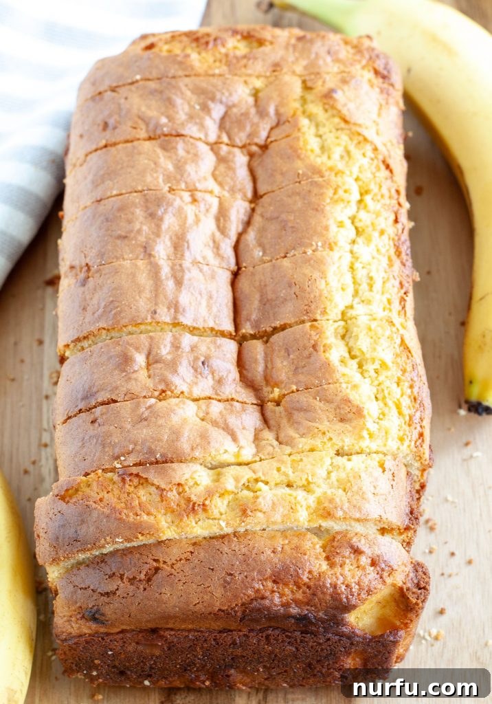 Easy Cake Mix Banana Bread 5 Beautifully sliced cake mix banana bread revealing a moist, tender crumb, with golden brown crust, ready to be served.