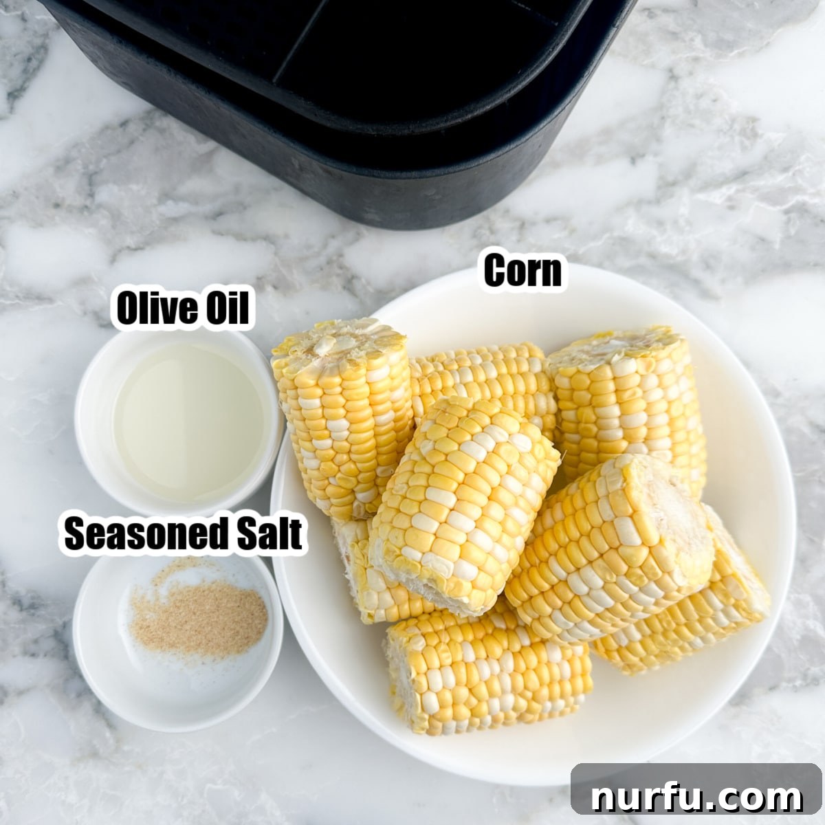 Perfect Air Fryer Corn 3 Bowl of fresh corn, a small bowl of olive oil, and seasoning salt.