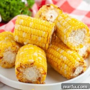 Plate of roasted corn on the cob.
