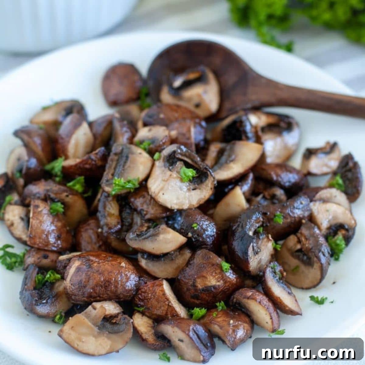Crispy Air Fried Mushrooms 2 Perfectly cooked air fryer mushrooms, ready to be served as a delicious side dish.