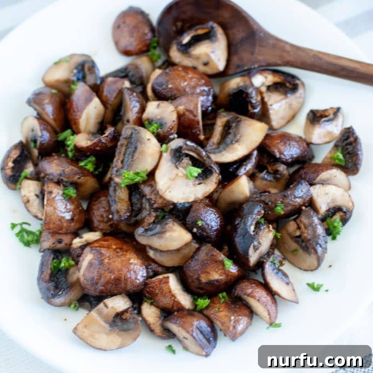 Crispy Air Fried Mushrooms 4 Close-up of golden brown air fryer mushrooms in a bowl, ready to eat.