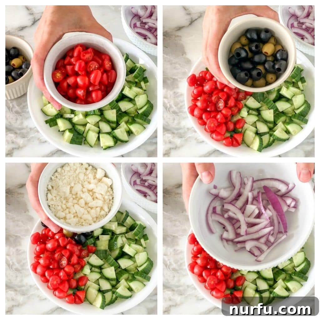 Refreshing Aegean Cucumber Medley 3 Close-up shot of the raw ingredients for Greek cucumber salad in a large glass bowl before dressing, showing vibrant green cucumbers, red halved tomatoes, purple thin-sliced red onion, black Kalamata olives, and white crumbled feta cheese, highlighting the fresh components.