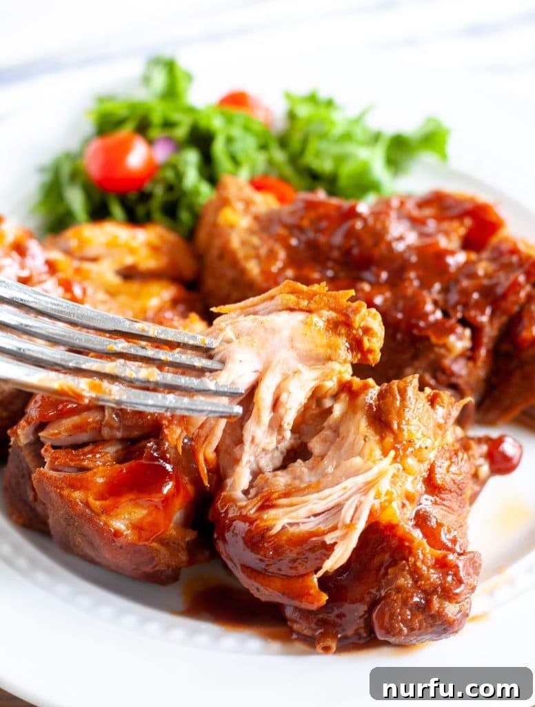 Fall-Off-The-Bone Instant Pot Country Ribs 2 Plate of perfectly cooked country style BBQ ribs, garnished and ready to eat.