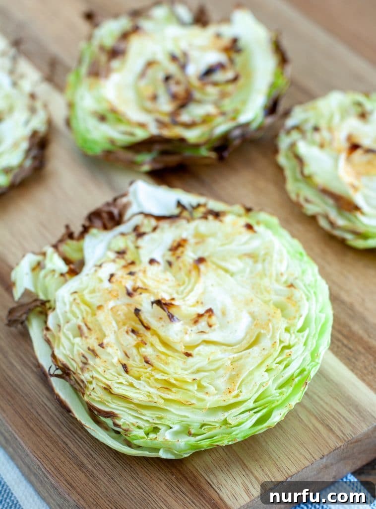 Crispy Air Fryer Cabbage 2 Roasted cabbage steak on a plate with crispy edges.