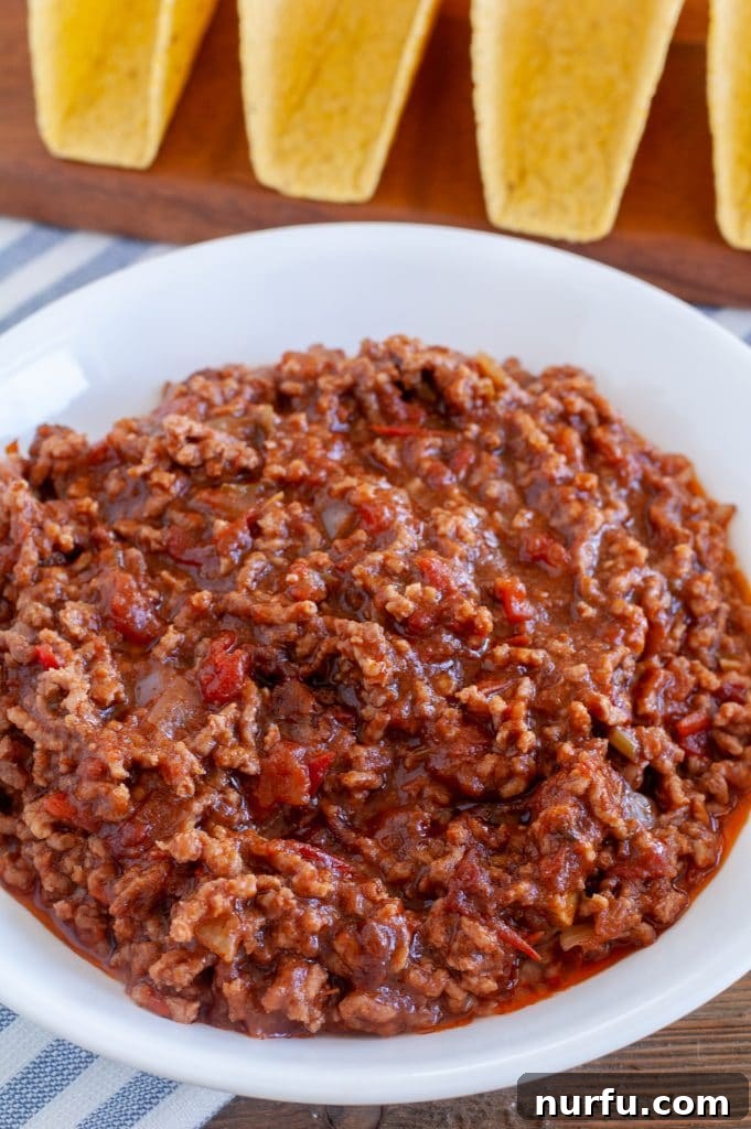 Effortless Slow Cooker Tacos 5 Perfectly cooked, seasoned ground beef in a bowl, ready for serving.