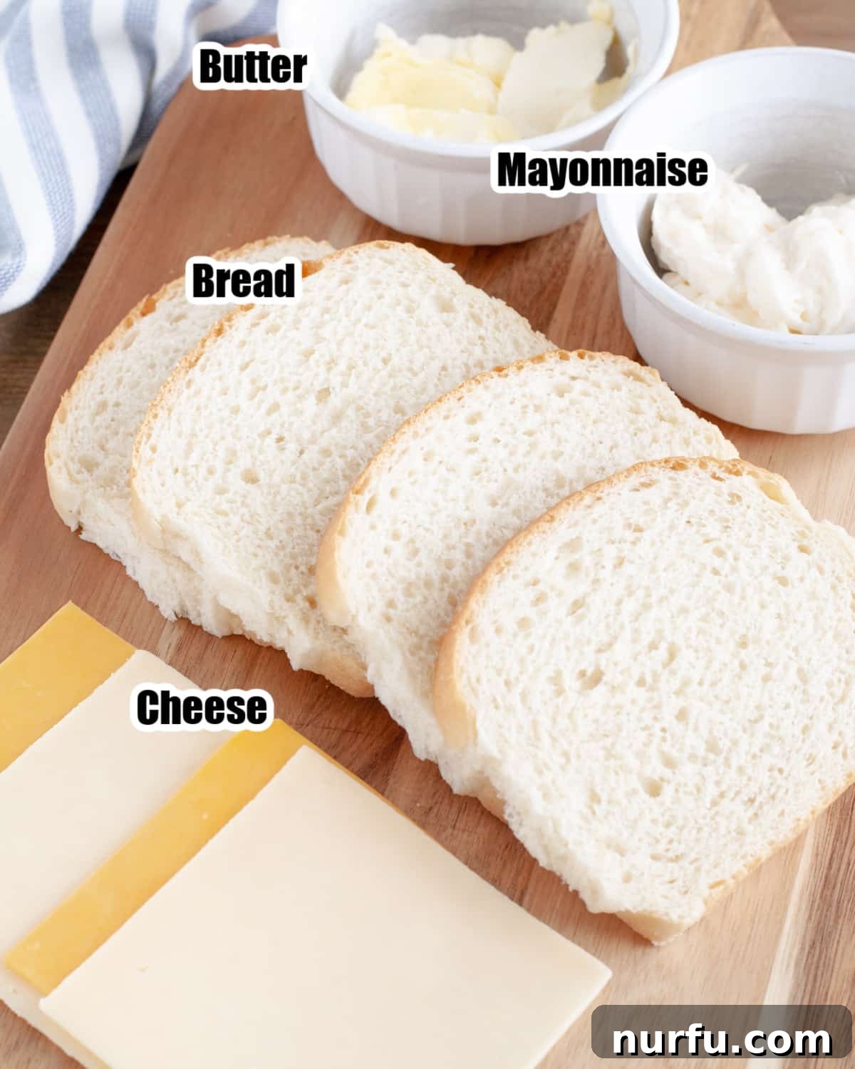Crispy Air-Fried Cheese Toastie 3 Slices of cheese, bread, and mayonnaise on a cutting board, ready for making grilled cheese.