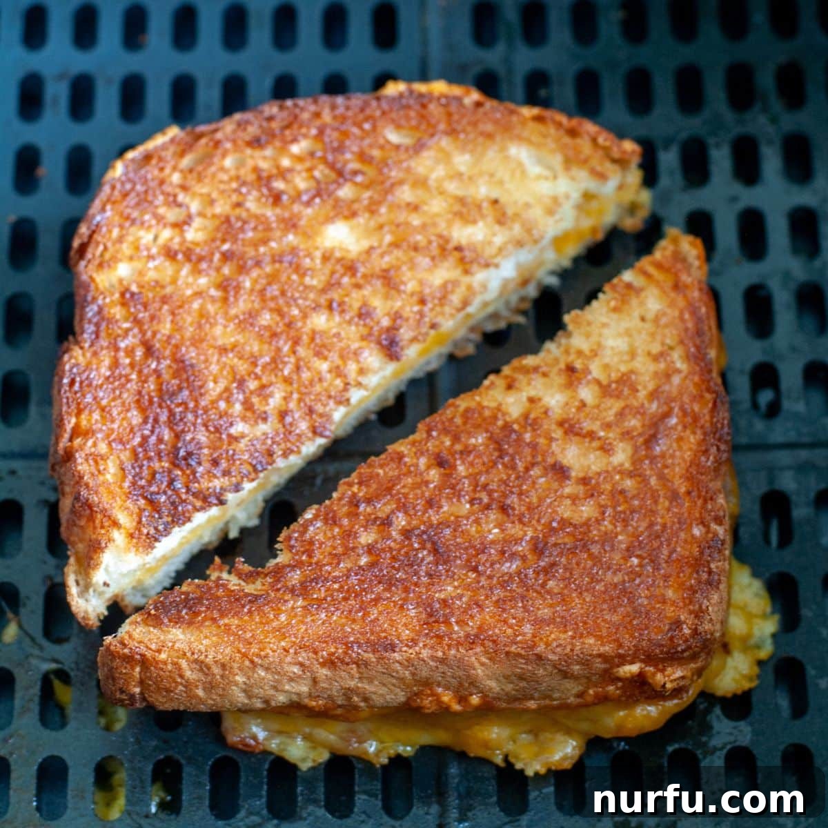 Crispy Air-Fried Cheese Toastie 7 A golden brown air-fried grilled cheese sandwich, perfectly toasted and ready to be served.