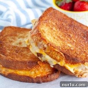Crispy Air-Fried Cheese Toastie 8 Two grilled cheese sandwiches on a plate.