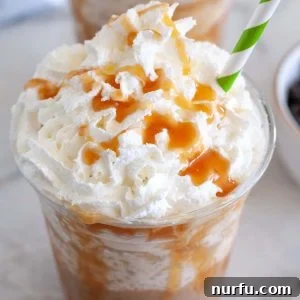 Glass of caramel frappuccino with whipped cream