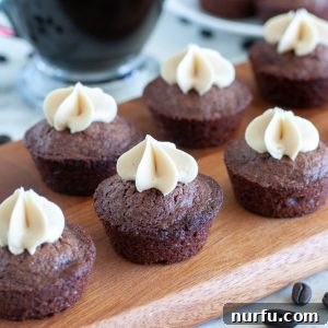 Beautifully arranged Espresso Brownie Bites on a serving tray, garnished with frosting.