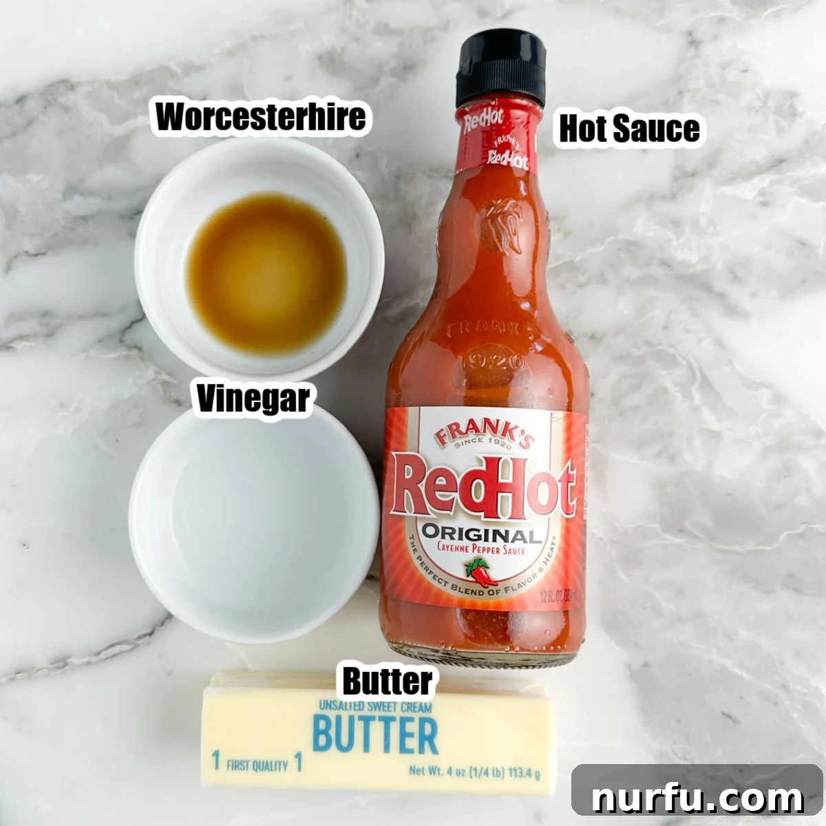 Easy Homemade Buffalo Sauce 3 Individual bowls showcasing the four essential ingredients for homemade buffalo sauce: hot sauce, melted butter, white vinegar, and Worcestershire sauce.