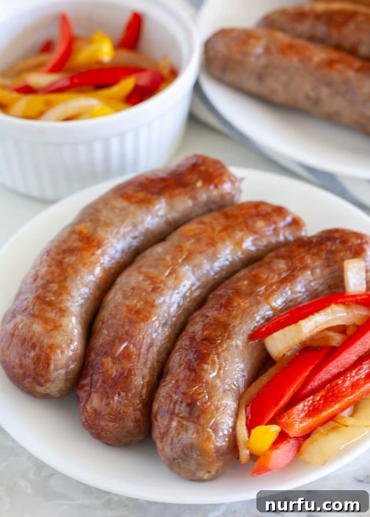 Crispy Air-Fried Sausages 2 Sausages on a plate with peppers