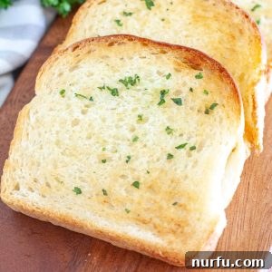 Slices of golden-brown Texas toast on a plate, ready to be served.