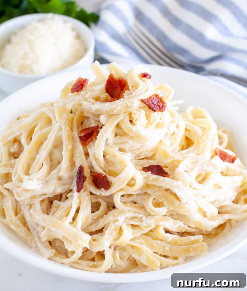 Creamy Indulgence Pasta 2 Creamy pasta on a plate garnished with bacon bits