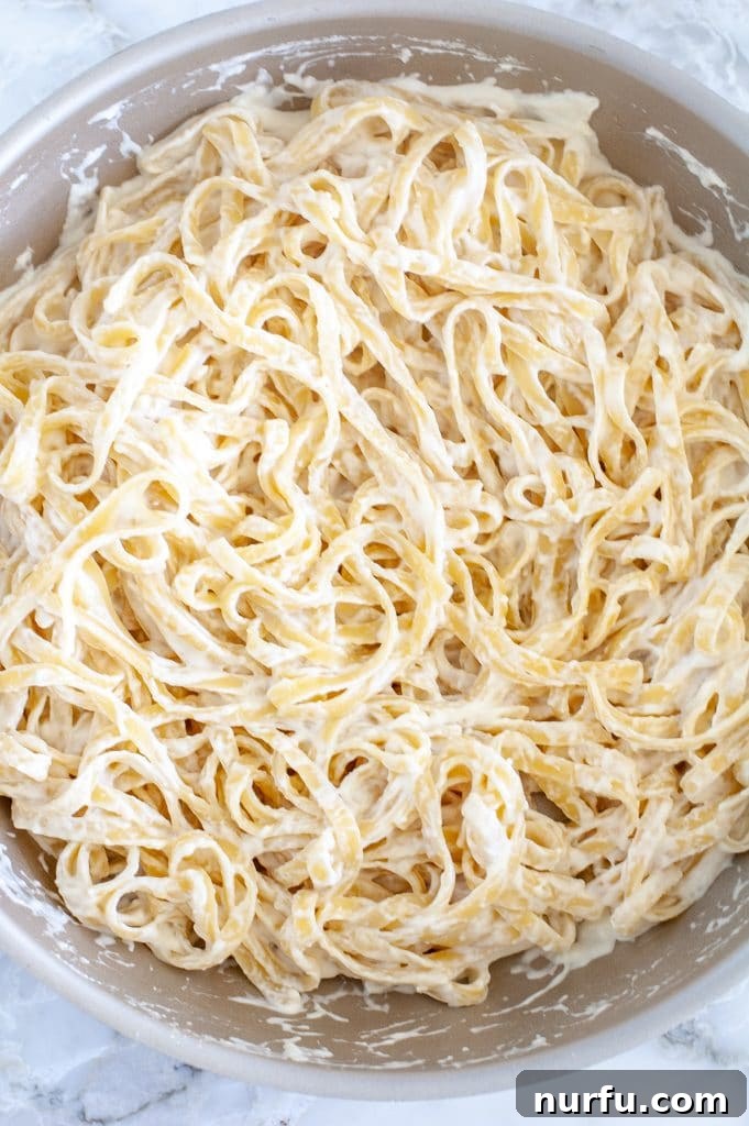 Creamy Indulgence Pasta 4 Cooked cream cheese pasta in a large skillet