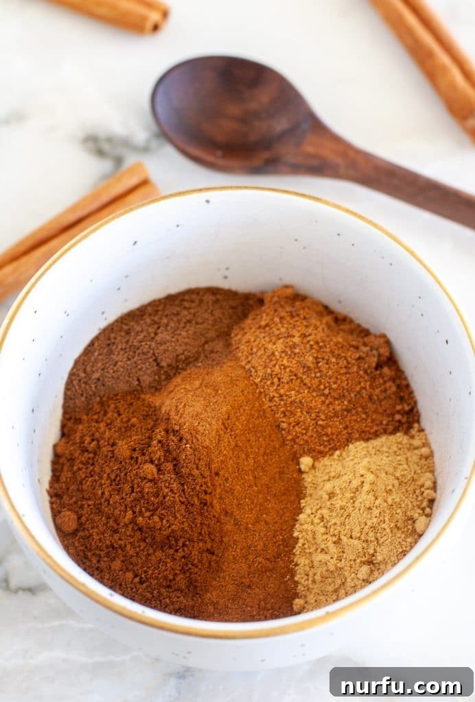 Signature Pumpkin Spice Blend 2 A bowl filled with homemade pumpkin pie spice, ready for use.