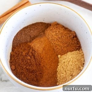 Signature Pumpkin Spice Blend 5 A beautifully arranged bowl of freshly mixed pumpkin pie spice, ready for all your fall recipes.