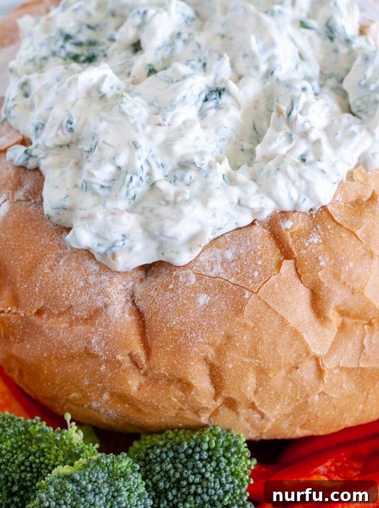Creamy Knorr Spinach Dip 2 Spinach dip in bread bowl with vegetables