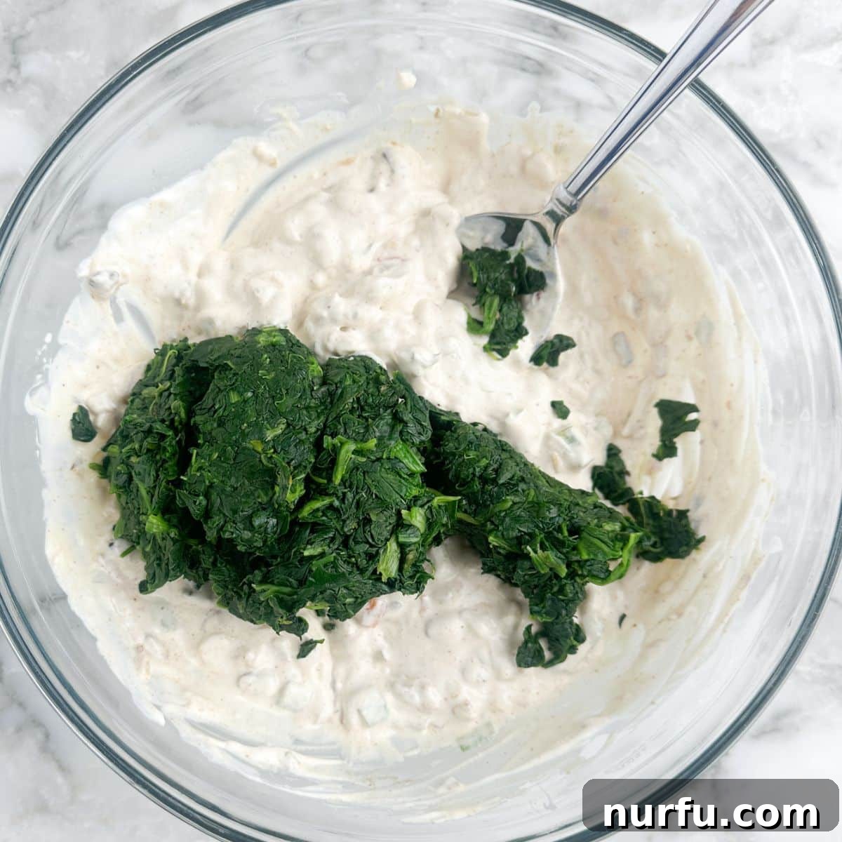 Creamy Knorr Spinach Dip 5 Bowl of creamy dip with frozen spinach.
