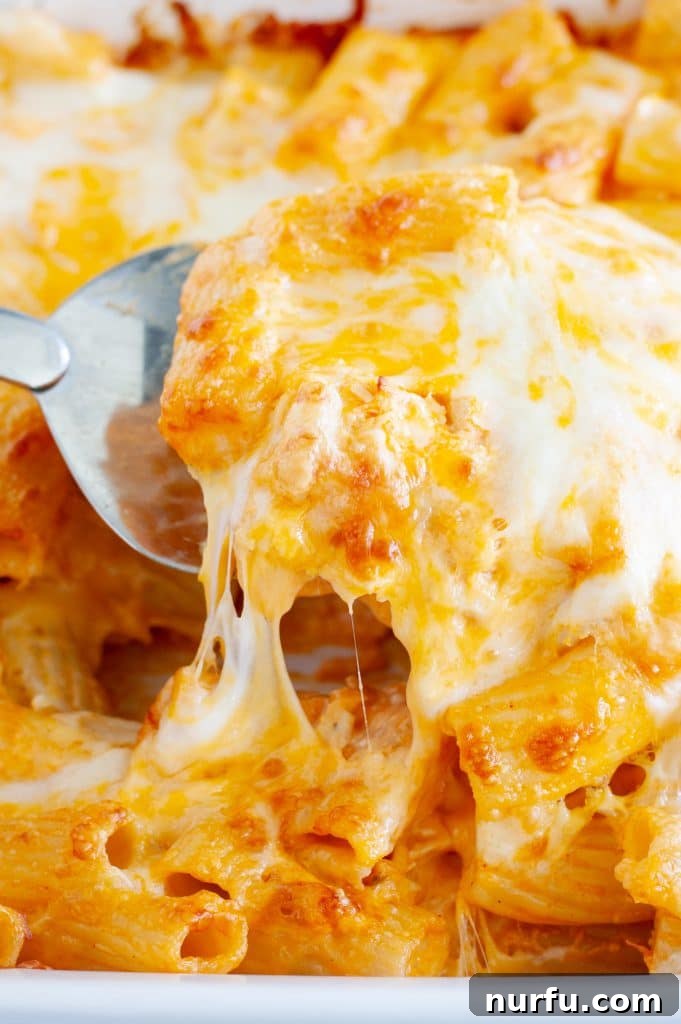 Creamy Buffalo Chicken Pasta Bake served with a spoon