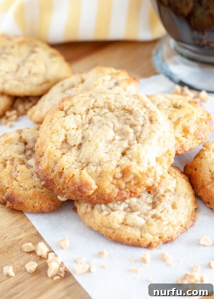 Freshly baked coffee toffee cookies arranged beautifully on a plate, showcasing their golden-brown edges and visible toffee bits.