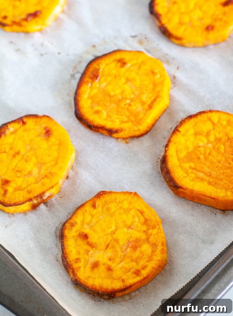Roasted Sweet Potato Rounds 4 Sliced sweet potatoes on a pan