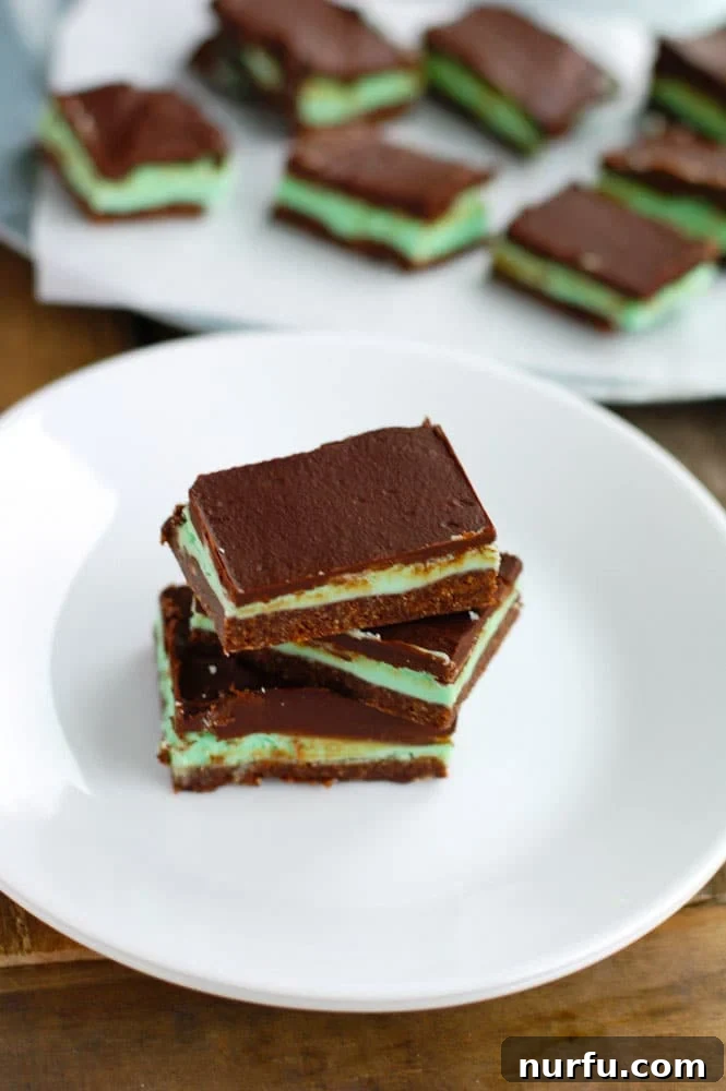 Close-up of a chocolate creme de menthe bar, showing the creamy mint layer.