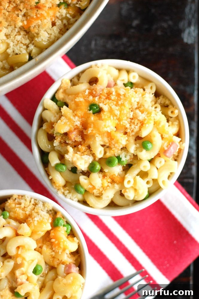 Hot and delicious Macaroni and Cheese with Ham and Peas Baked Macaroni and Cheese with Ham and Peas, golden brown and bubbly