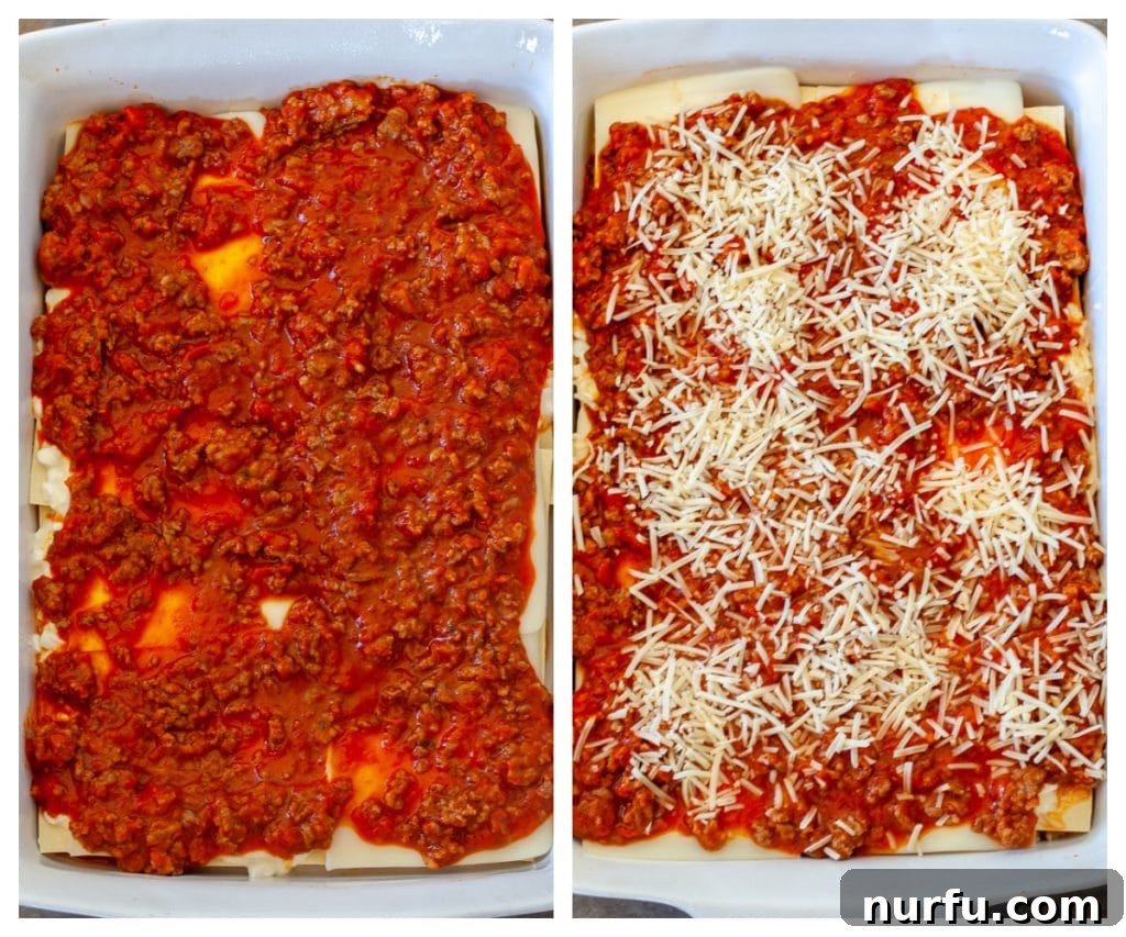 The top layer of an unbaked lasagna, richly covered with marinara sauce and generously sprinkled with shredded Parmesan cheese, promising a golden crust.